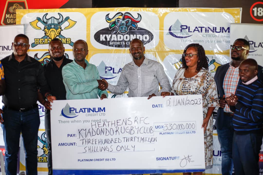 Officials from Platinum Credit, Kyadondo Sports Club plus some Heathens player representatives pose with a dummy cheque on Thursday.
