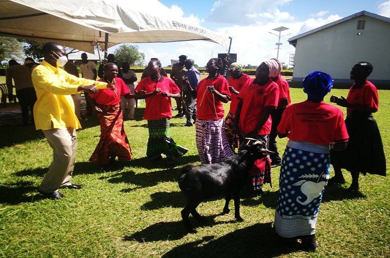 Sam Wadri Nyakua, the Arua City Mayor (R) joins Agan women group members in dancing after receiving the Mubende Goat on Friday. PHOTO BY ANDREW COHEN AMVESI