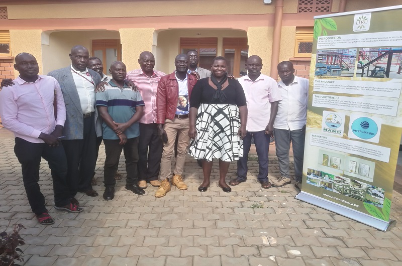 Some of the members of Cassava and Allied Crops Cooperative Society pose for a group photo with Ejua (3L) after the meeting on Saturday