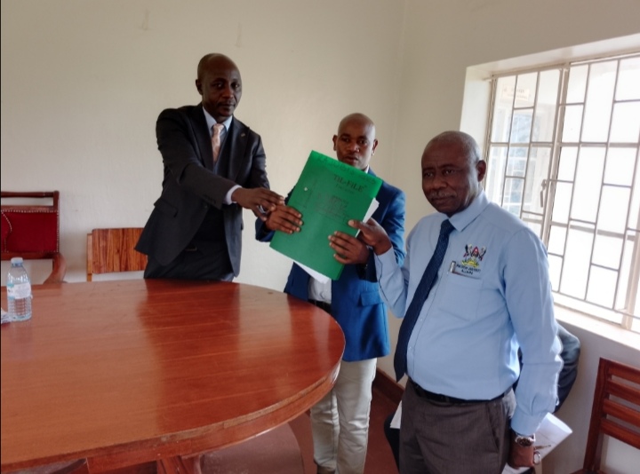 Benon Kajubi, Mayor Kyabwisho and Nathan Mugume during the release of Pre-PLE Exams