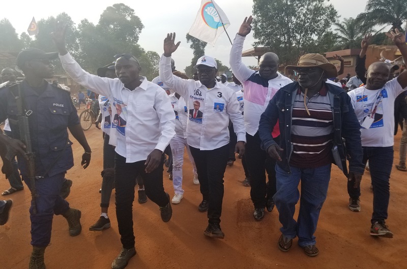 MP Hopeful, Fils (C) with his team during one of the rallies in Aru, Eastern DRC.
