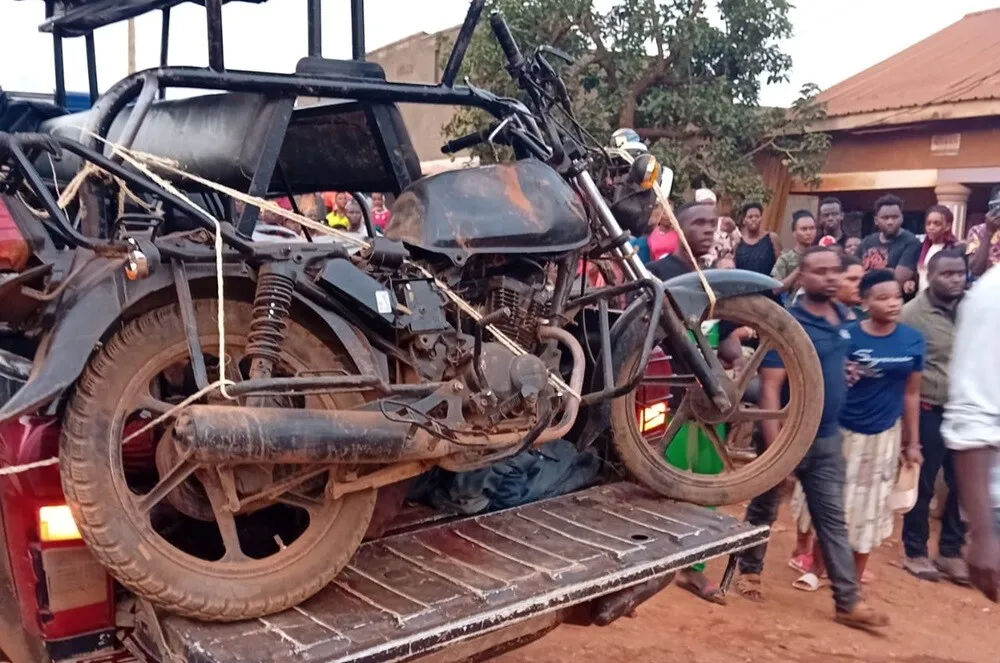 THE MOTROCYCLE ON WHICH THE ASSAILANTS HAD FLED BEFORE THEY WERE APPREHENDED AND KILLED BY THE ANGRY MOB (PHOTOVIA @POLICEUG)