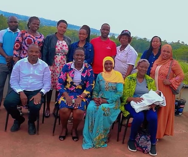 Hon Ssasaga Isiah in group picture with USSSA-Bugisu zone female games teachers