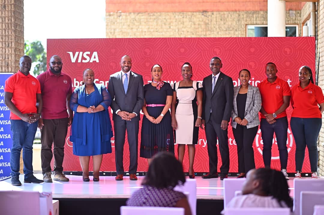 Officials from Absa Bank Uganda and Visa pose for a photo moment after the launch of the Absa Card Send.