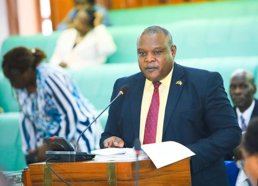 Hon. Tonny Ayoo, presenting the committee report to Parliament Credit Parliament Media