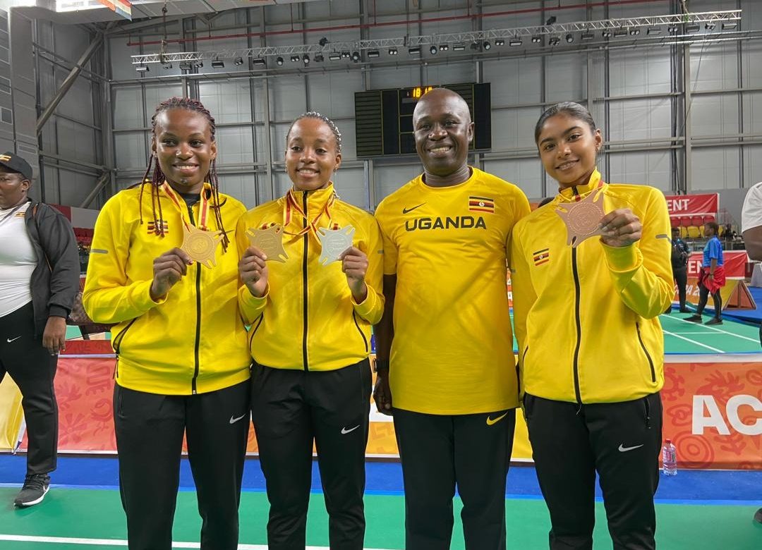 Minister Ogwang with Badminton medalists at Africa games in Ghana