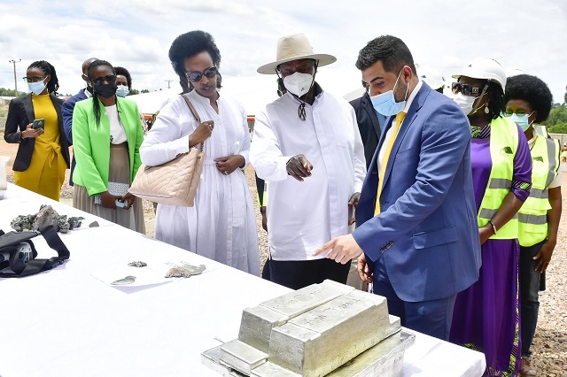 Omid Ameri managing director Woodcross resources shows President Museveni Complete processed Tin at the Commissioning of the Factory